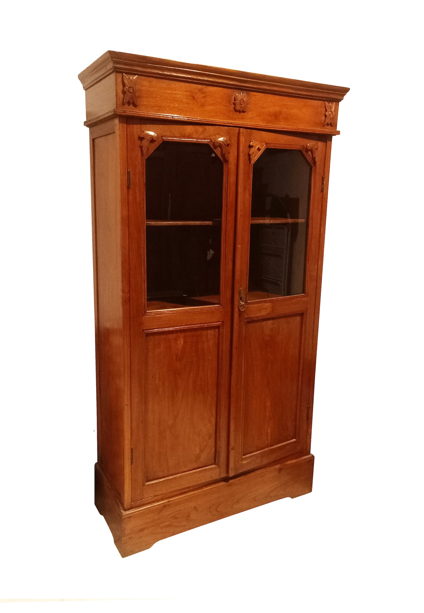 An early 20th century carved teak cupboard